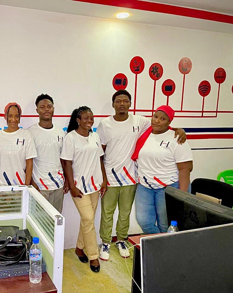 The Hadi Technologies team in matching tricolour uniforms